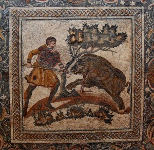 A man hunting down a boar on a 4th century AD Roman mosaic